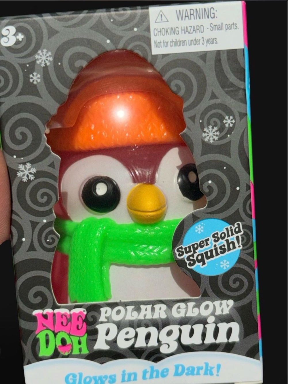 Nee Doh Polar Glow Penguin Squishy Toy - Green Scarf, Orange Hat pink body.